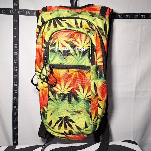 Vibedration Hydration Backpack w/o bladder - green, orange, black leaves… - Picture 1 of 16